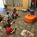 Children fascinated in a LEGO program