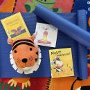Books and a yoga mat are ready for Yoga Storytime!