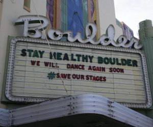 Boulder Theater marquee reading "Stay Healthy Boulder"